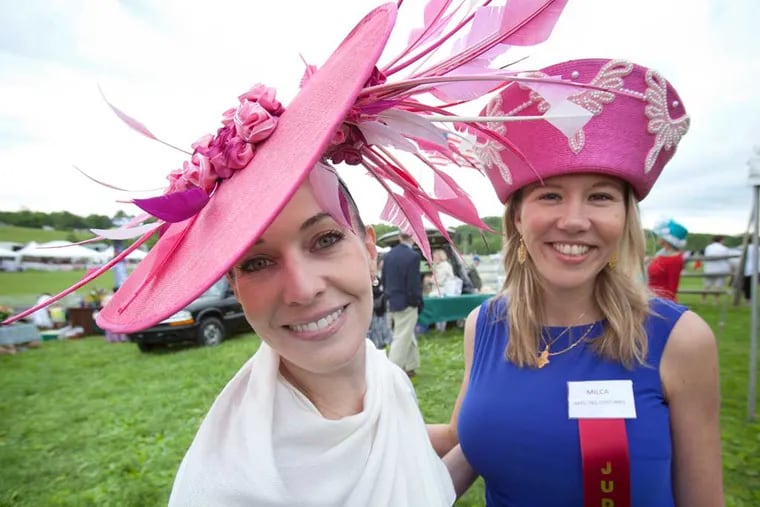 Tiffany Arey, left, and Milica Schavio show off their race-day finery. ( ED HILLE / Staff Photographer )
