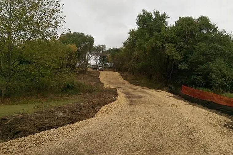 Photo shows access road made by the EPA for cleanup at the Clearview Landfill in Philadelphia's Eastwick section.