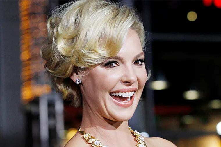Actress Katherine Heigl poses at the premiere of "New Year's Eve" in Hollywood, California in this December 5, 2011 file photo. Actress Katherine Heigl has filed a $6 million civil lawsuit against New York pharmacy Duane Reade for using her name and an unauthorized paparazzi photograph of her in its commercial advertising.    (Reuters/Mario Anzuoni/Files)