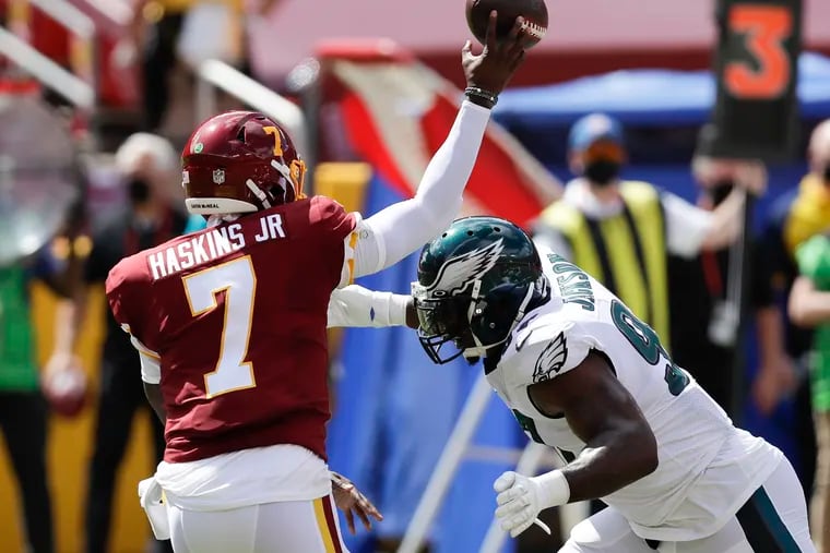 Eagles defensive tackle Malik Jackson goes after Washington quarterback Dwayne Haskins during the first quarter Sunday.