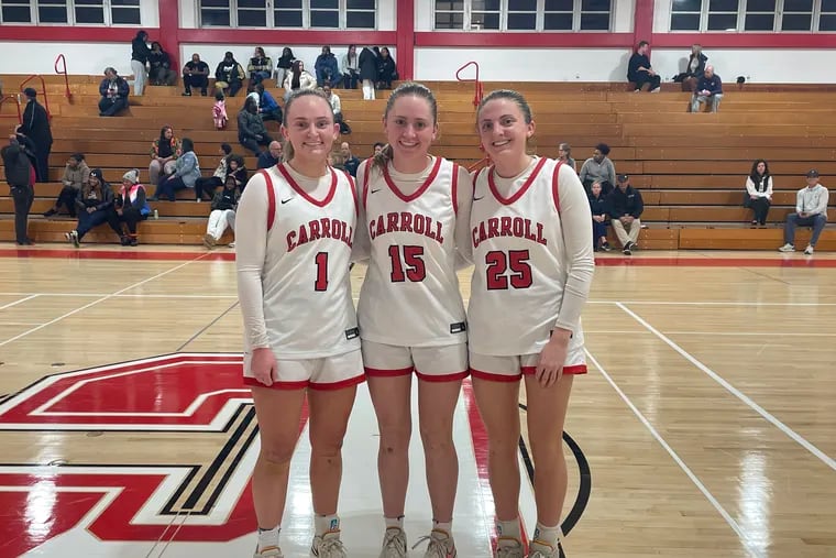From left, Archbishop Carroll senior Felicity McFillin, freshman Abbie McFillin, and junior Maddie McFillin pose after a game earlier this season.