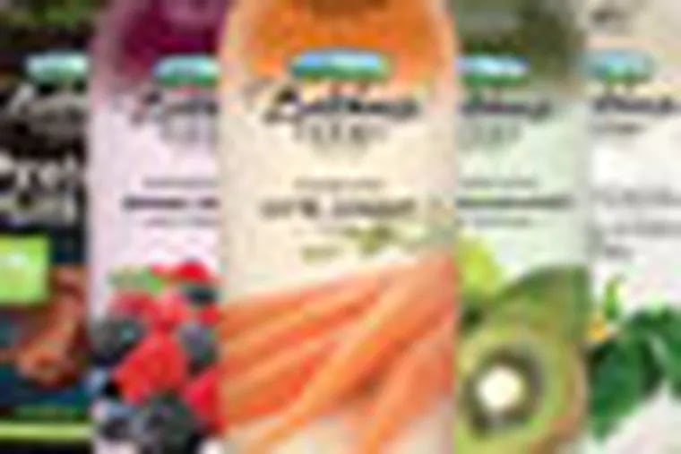This undated handout image provided by Campbell Soup. Co. shows bottles of Bolthouse Farms drinks. Campbell Soup Co., said Monday, July 9, 2012,  that it will buy natural foods maker Bolthouse Farms in a $1.55 billion cash deal from private equity firm Madison Dearborn Partners LLC. Campbell says Bolthouse’s line of juices and carrots will help it feed Americans’ growing appetite for fresher foods.  (AP Photo/Campbell Soup)