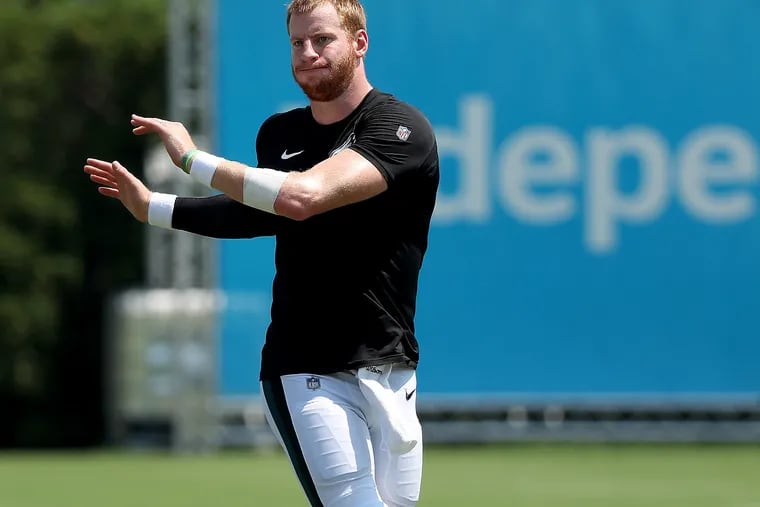 Eagles quarterback Carson Wentz warms up during a joint practice between the Philadelphia Eagles and the Baltimore Ravens in Philadelphia, PA on August 19, 2019.