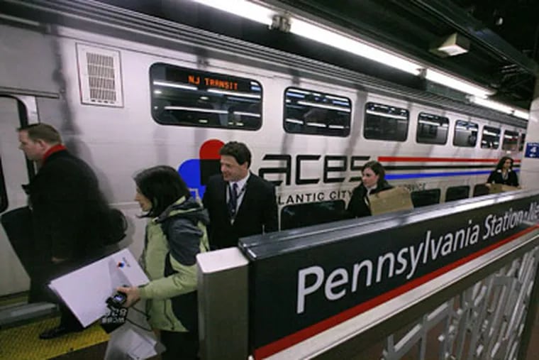 Riders board the new Atlantic City Express Service (ACES) train at Penn Station in New York, on Jan. 30. ACES is a venture of Atlantic City casinos to operate a weekend train service between New York and Atlantic City. (AP Photos / Bebeto Matthews)
