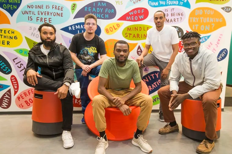 Jumpbutton Studio co-founder Nicodemus Madehdou (center), a 22-year-old tech entrepreneur, with (from left) Dominique Wyche, Sean Davalos, Nicodemus Madehdou, Mahdi Sharif, and Ololade Bello.