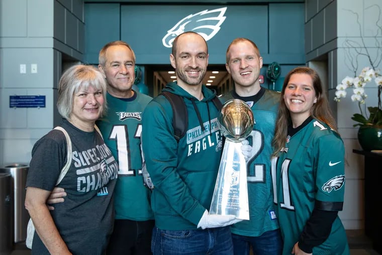 Matt MacMillan and his family pose with the Lombardi Trophy.