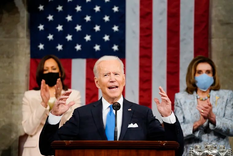 Vice President Kamala Harris, and House Speaker Nancy Pelosi of Calif., stand and applaud as President Joe Biden addresses a joint session of Congress Wednesday in the House Chamber at the U.S. Capitol in Washington.