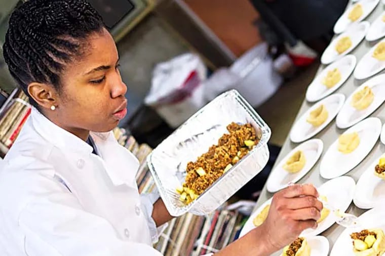 Takia McClendon prepares desserts at one of Uptown Soul Food's "Supper Club" events. Bryant Terry will speak and sign books at the next one, April 28, which will feature recipes from his new book Afro Vegan.