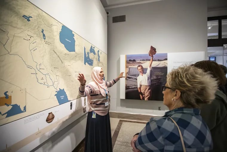 Moumena Saradar, a refugee from Syria, guiding visitors at the Penn Museum before the pandemic.