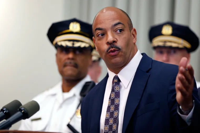 District Attorney Seth Williams announces charges. At left is Police Commissioner Richard Ross.