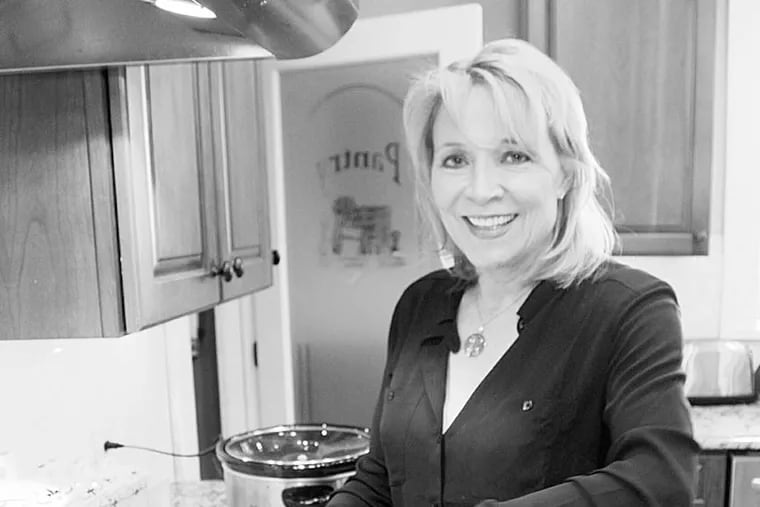 Susanne LaFrankie-Principato cooking meatballs Sunday in the kitchen at her home in Haddonfield. (Courtesy of Susanne's daughter, Victoria Principato)