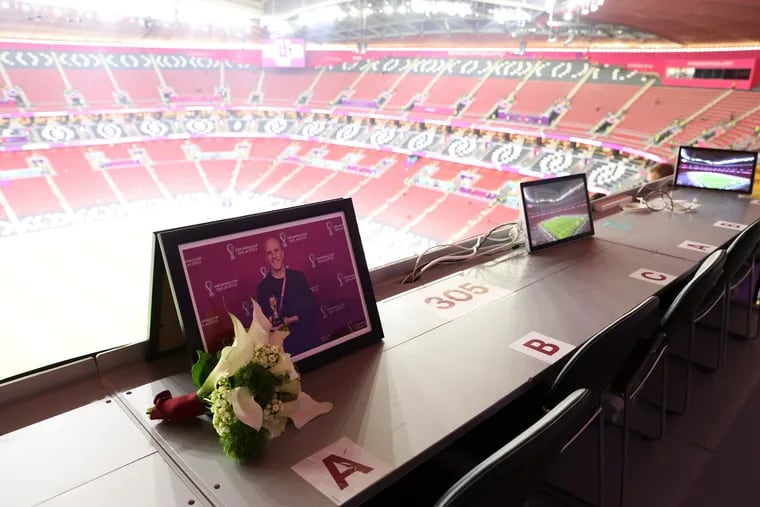 Flowers were placed in memory of Grant Wahl, a U.S. sports journalist who died while reporting on the Argentina-Netherlands match, before the World Cup quarterfinal between England and France at Al Bayt Stadium on Saturday in Al Khor, Qatar.