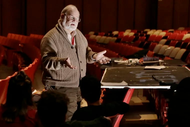 Cherry Hill High School East theater director Tom Weaver talks with crew members before a dress rehearsal at the school on February 28, 2019. Weaver is retiring after more than 40 years of teaching and directing the school's plays. For his last production, the school will be putting on "Fiddler on the Roof."