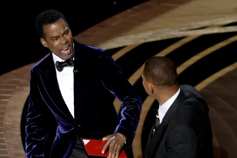 Will Smith (right) slaps Chris Rock onstage during the 94th Annual Academy Awards at Dolby Theatre in March.