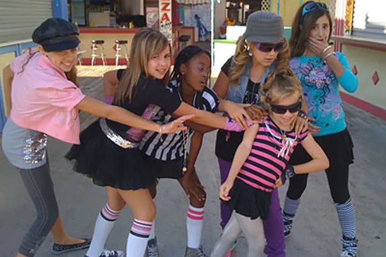 The Ovations, the group of middle-school "good girls" who vie against the "mean girl" Wiggies in a music-video competition.