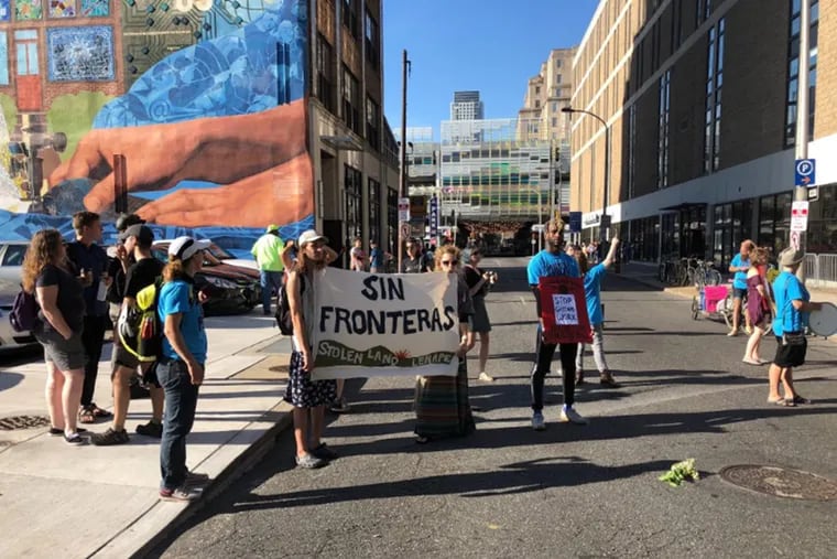 A small group of protesters gather outside of the ICE building in Center City on July 18, 2018.