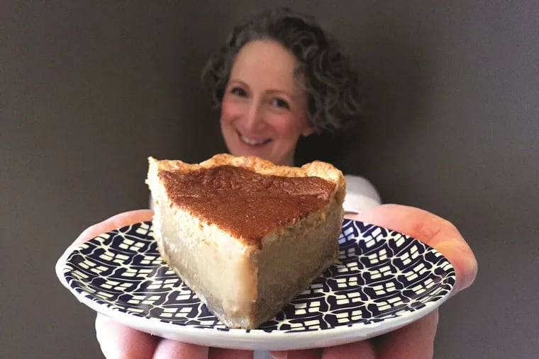Holly Ricciardi of Magpie with a slice of one of the 30,000 pies she sold during six years at 1622 South St.
