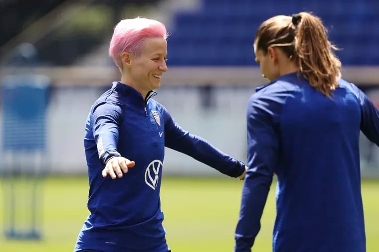 Megan Rapinoe (left) sported a pink hairdo at the U.S. women's soccer team's Saturday practice at Red Bull Arena.