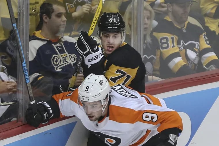Flyer defenseman Ivan Provorov checks the Penguins’ Evgeni Malkin during the second period Philadelphia’s 4-2 win Friday in Pittsburgh.