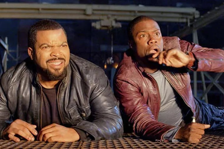 This image released by Universal Pictures shows Ice Cube, left, and Kevin Hart in a scene from "Ride Along." (AP Photo/Universal Pictures)