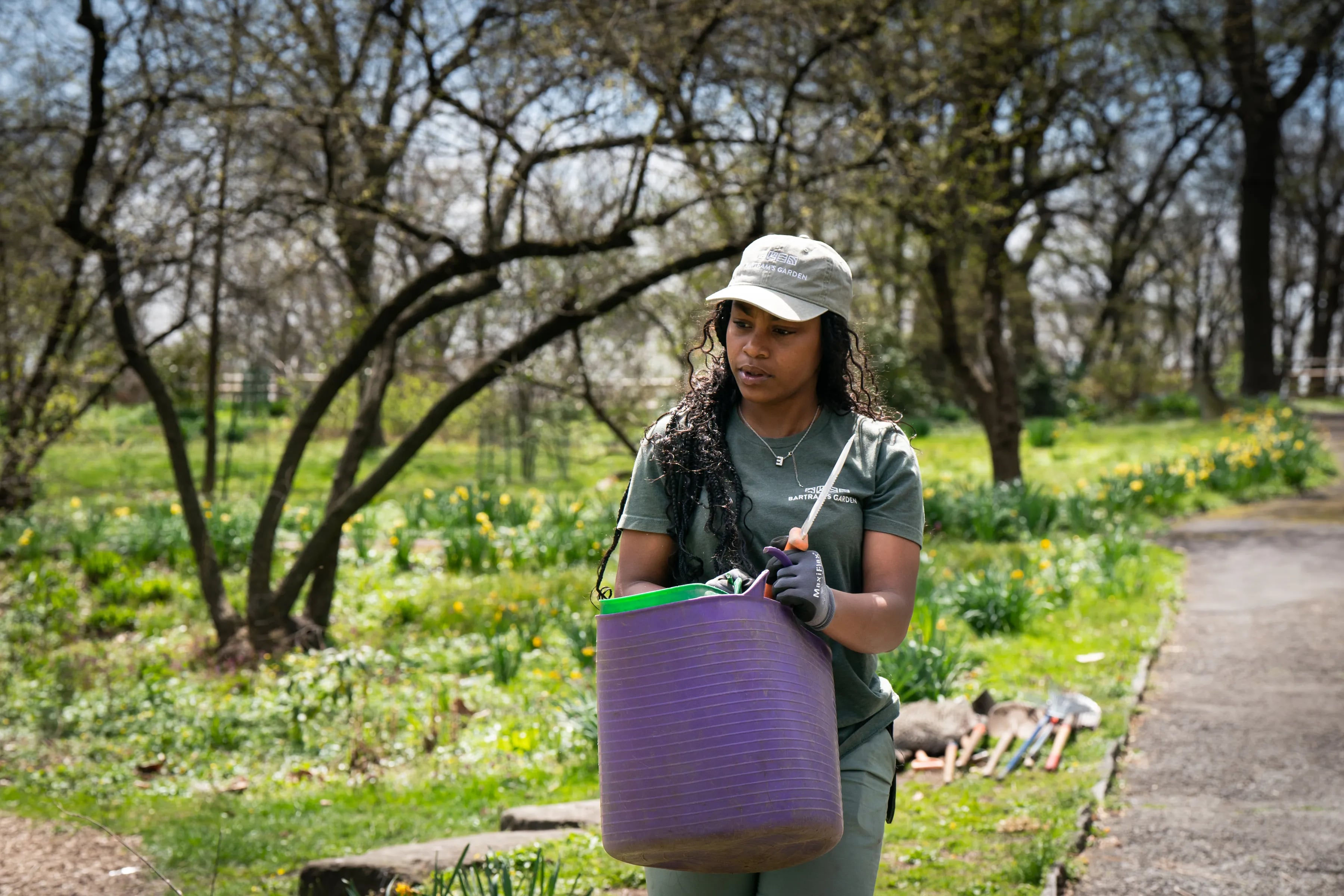 Seasonal Gardener Jadah Johnson at work at Bartram's Garden, in Philadelphia, Tuesday, April, 9, 2024.