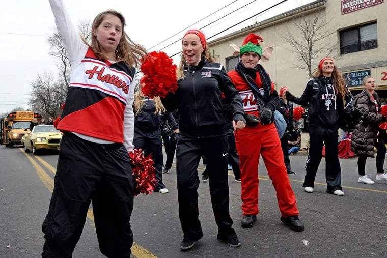 Cheerleaders (from left) Melanie Day, Chelsey West, Tyler Becker, Nicholle Meyrick, and Jen Korenki march in a Thanksgiving parade for Hatboro-Horsham High School, which is part of a national inclusive cheerleading initiative.