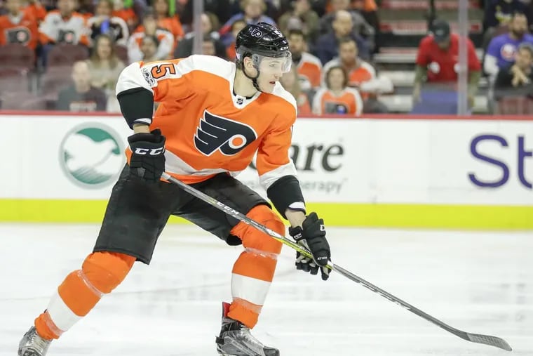 Flyers defenseman Samuel Morin skates with the puck against the New York Islanders in one of his two NHL games last season.