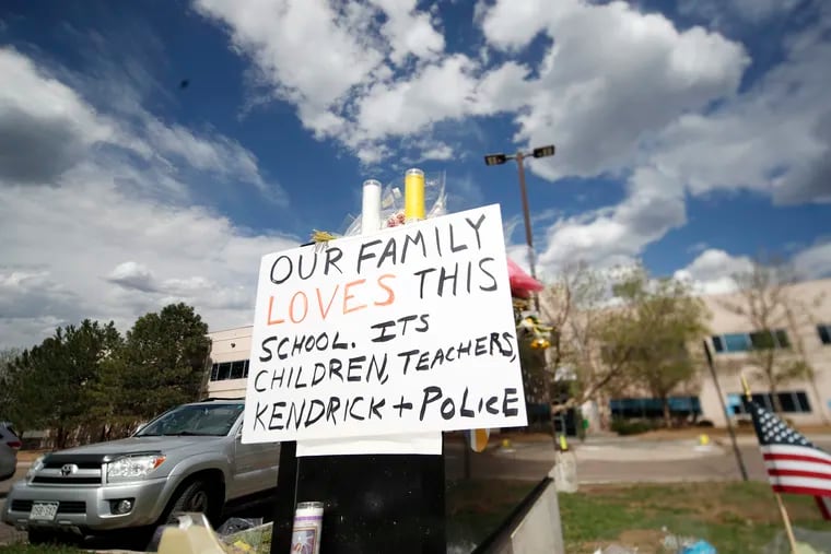 Display grows outside the STEM School Highlands Ranch a week after the attack on the school that left one student dead and others injured Tuesday, May 14, 2019, in Highlands Ranch, Colo.