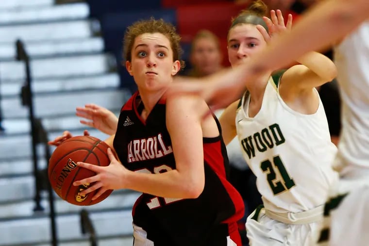 Erin Sweeney of Archbishop Carroll drives past Lindsay Tretter of Archbishop Wood during the third quarter of a PIAA Class 5A state basketball quarterfinal Saturday, March 16, 2019, at Cardinal O'Hara. Carroll went on to win, 63-48.