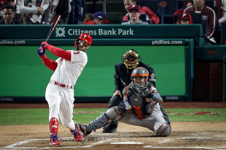 Phillies designated hitter Bryce Harper hits a two-run homer in the first inning of Game 3 against the Houston Astros.