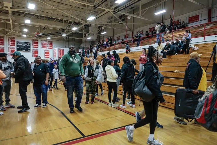 Camden-Eastside game postponed after a confrontation between the two teams. People leave the gym in Cherry Hill East Feb. 16.
