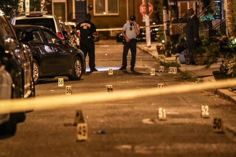 Police investigate the scene where two men were fatally wounded in a quadruple shooting on the 1200 block of South Bucknell Street. Thursday, June 23, 2022.