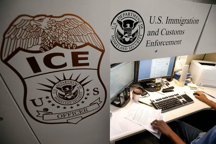 FILE - An unidentified Immigration and Customs Enforcement deportation officer reviews forms on April 26, 2017, at the the Pacific Enforcement Response Center in Laguna Niguel, Calif. (Allen J. Schaben/Los Angeles Times/TNS)
