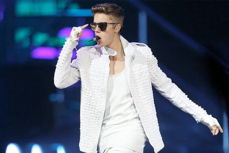 Justin Bieber ditched his reservation at the Four Seasons. In this photo, he performs at the Wells Fargo Center Wednesday, July 17, 2013. (YONG KIM / Staff Photographer)