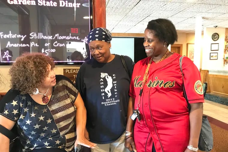 Alvina Wimbish, (left) Connie Davis and Diane Smith areamong the very few women who attend a post-traumatic stress disorder peer support group that meets at the Garden State Diner