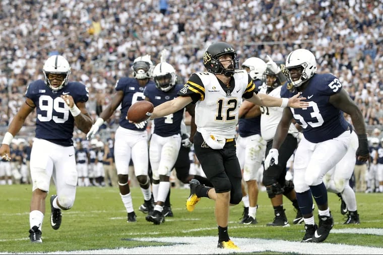 Appalachian State quarterback Zac Thomas runs in for a touchdown against Penn State during the second half the Nittany Lions' win on Saturday.