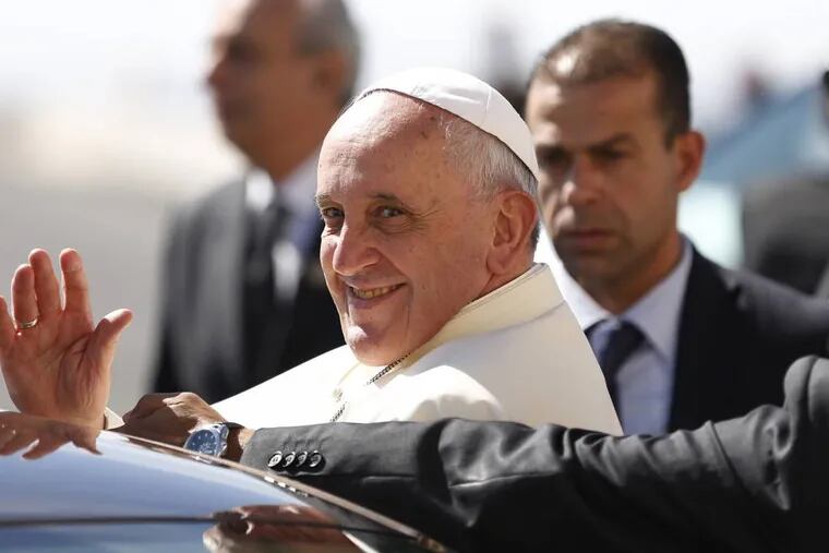 Pope Francis waves upon his arrival at the West Bank town of Bethlehem on Sunday, May 25, 2014. Pope Francis landed Sunday in the West Bank town of Bethlehem in a symbolic nod to Palestinian aspirations for their own state as he began a busy second day of his Mideast pilgrimage. (AP Photo/Mohamad Torokman, Pool)