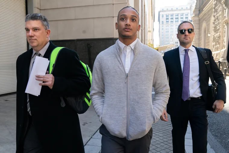 Michael White exits the Stout Center for Criminal Justice in Philadelphia after a preliminary hearing last October. White is charged with third-degree murder in the stabbing death of Sean Schellenger.
