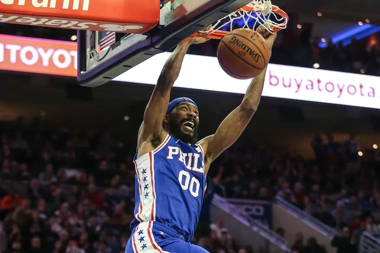 Sixers' Corey Brewer dunks against the Rockets during the second quarter.