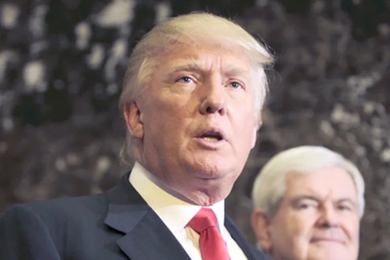 Republican presidential candidate, former House Speaker Newt Gingrich listens at right as Donald Trump talks to media after a meeting in New York on Monday.  (AP Photo/Seth Wenig)