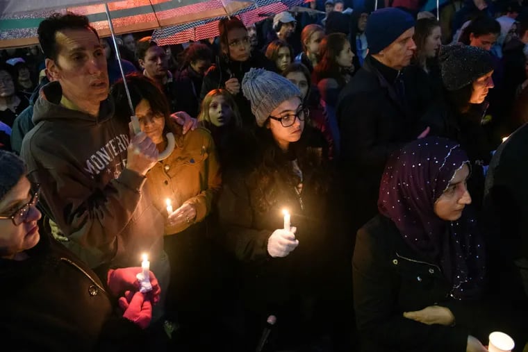 Mourners participate in a vigil on Saturday evening in the Squirrel Hill neighborhood of Pittsburgh, where 11 people were killed in a mass shooting earlier in the day at the Tree of Life Synagogue.