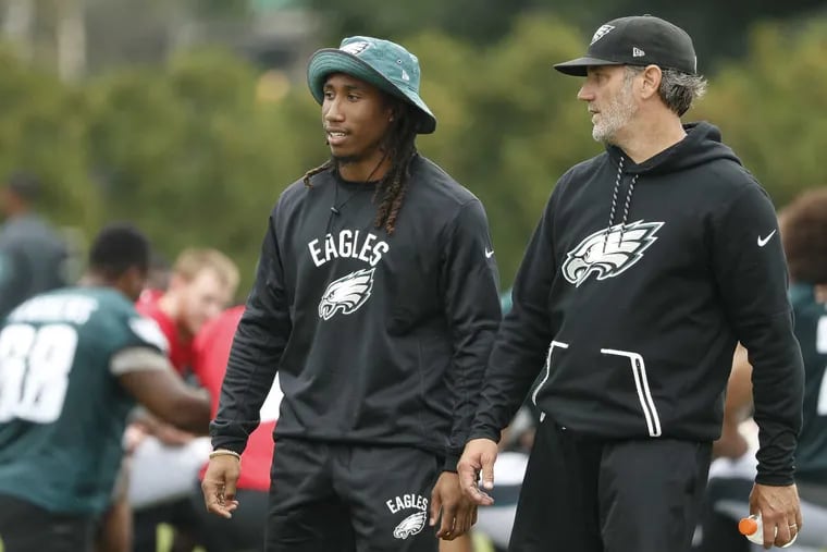 Ronald Darby, left, and defensive backs coach Cory Undlin, right, talks during Eagles training camp in Philadelphia, PA on August 12, 2017.