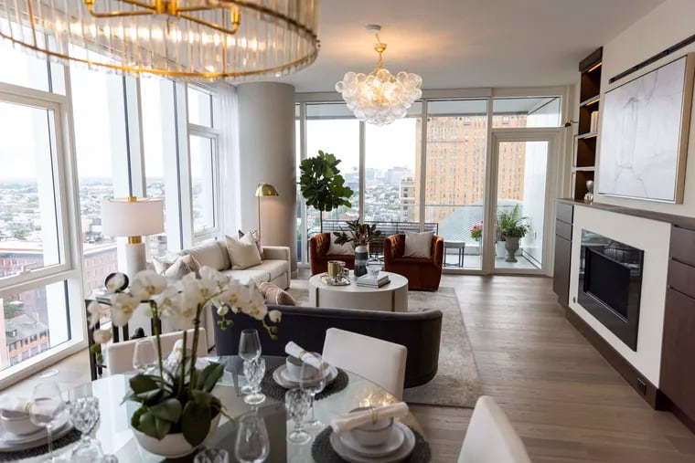 The living room and dining area of the 1,730-square-foot, two-bedroom and two-bath unit on the 18th floor of the new model homes at the Arthaus condominiums along South Broad Street.