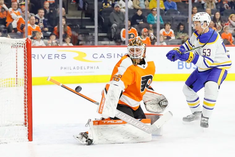 Flyers goaltender Felix Sandstrom uses his stick to stop the puck against Buffalo Sabres left wing Jeff Skinner in the first period.