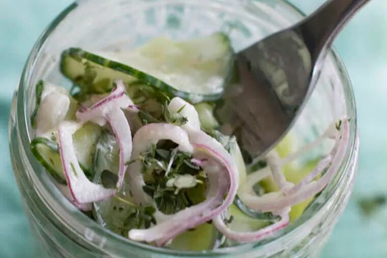 This July 22, 2013 photo taken in Concord, N.H. shows pressed cucumber salad with sour cream. (AP Photo/Matthew Mead)