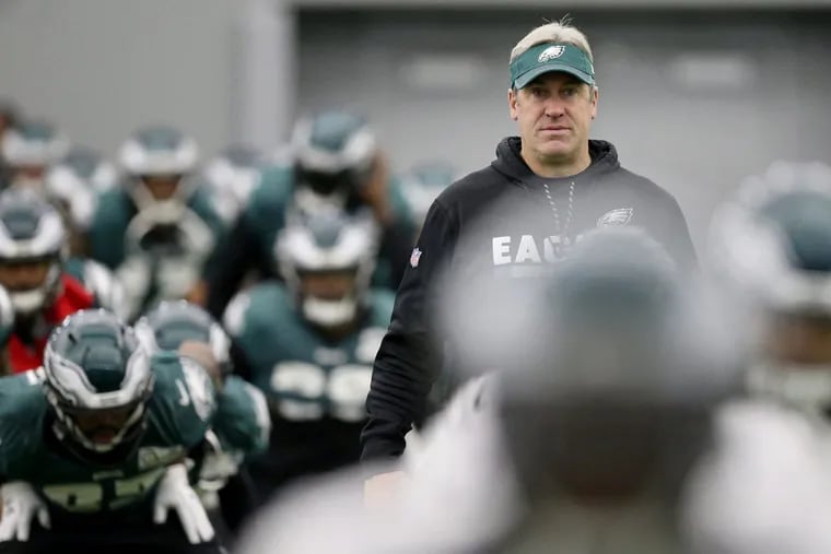 Head coach Doug Pederson watches players warm up during Eagles practice at the NovaCare Complex on Thursday, Jan. 25, 2018. TIM TAI / Staff Photographer