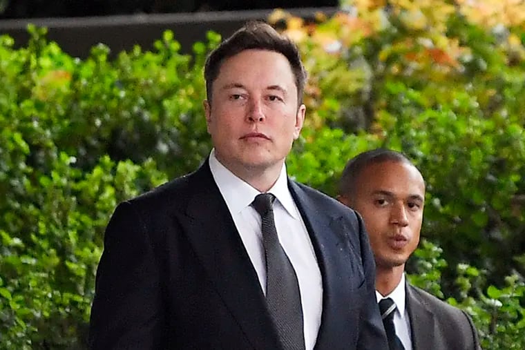 FILE - In this Wednesday, Dec. 4, 2019 file photo, Tesla CEO Elon Musk arrives at U.S. District Court in Los Angeles. Musk did not defame a British cave explorer when he called him “pedo guy” in an angry tweet, a Los Angeles jury found Friday, Dec. 6, 2019.