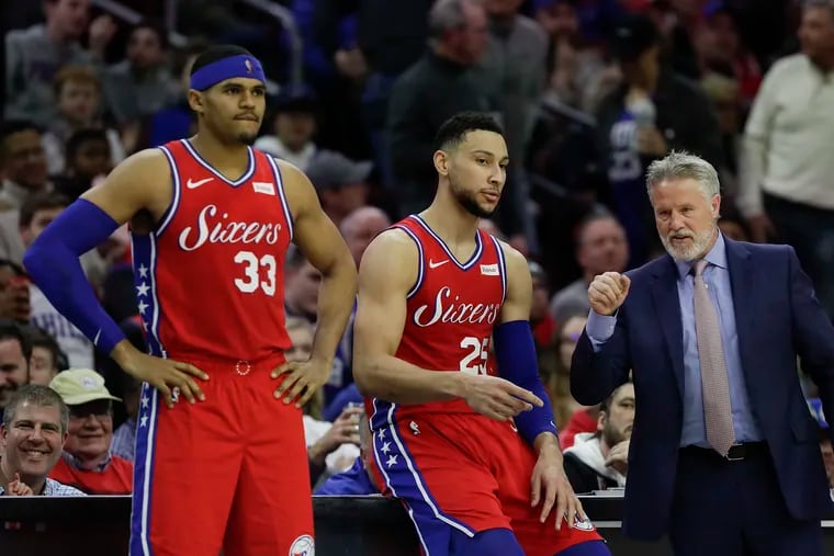 Sixers Head Coach Brett Brown talks to guard Ben Simmons and forward Tobias Harris during the fourth-quarter against the Denver Nuggets on Friday, February 8, 2019 in Philadelphia.