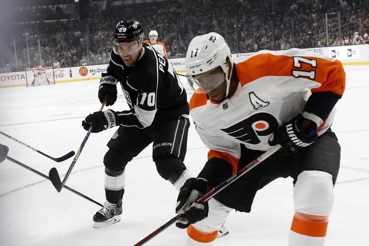 Right winger  Wayne Simmonds (17) gains position on Kings forward Tanner Pearson  in action during Thursday's 5-2 Flyers win.
