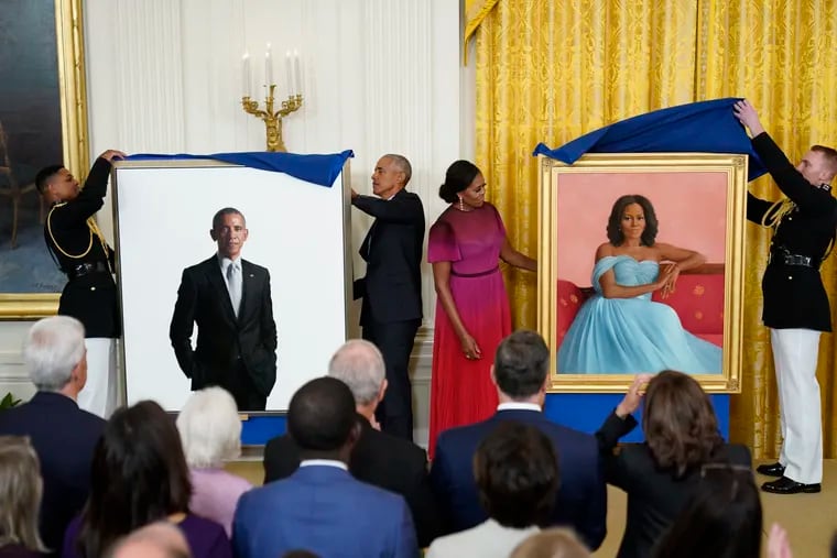 Former President Barack Obama and former first lady Michelle Obama unveil their official White House portraits during a ceremony in the East Room of the White House on Wednesday.